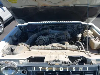 1990 Mitsubishi Montero z VIN JA4GJ31S0LJ009870, wystawiony jako IAAI lot #42192378 z przebiegiem 200 028 mil mil oraz . Historia ofert i sprzedaży dostępna na DreamBid. Obrazek 10.