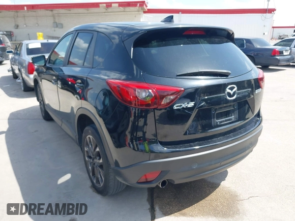 2016 Mazda CX-5 Grand Touring z VIN JM3KE2DY2G0765444, wystawiony jako IAAI lot #42527577 z przebiegiem 162 871 mil mil oraz . Historia ofert i sprzedaży dostępna na DreamBid. Obrazek 3.