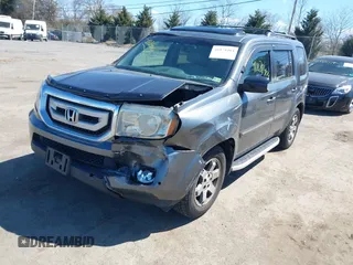 2011 Honda Pilot Touring with VIN 5FNYF4H95BB090892, listed as a IAAI auction lot 41878404 with 131,757 mi miles. Bid and sale history available at carsss.com. Image 2.