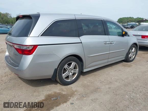 2012 Honda Odyssey Touring with VIN 5FNRL5H92CB055473, listed as a IAAI auction lot 42128601 with 163,901 mi miles. Bid and sale history available at carsss.com. Image 4.