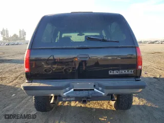 1998 Chevrolet Tahoe with VIN 3GNEK18R6WG102052, listed as a Copart auction lot 77485244 with 187,542 mi miles and Salvage Title. Bid and sale history available at carsss.com. Image 6.