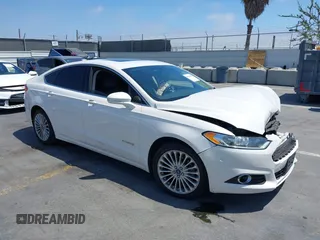 2014 Ford Fusion Titanium Hybrid with VIN 3FA6P0RU7ER291833, listed as a IAAI auction lot 42734386 with 163,099 mi miles and . Bid and sale history available at DreamBid. Image 1.