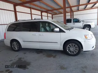 2014 Chrysler Town & Country Touring-L with VIN 2C4RC1CG2ER312444, listed as a IAAI auction lot 42050774 with 124,010 mi miles. Bid and sale history available at carsss.com. Image 13.
