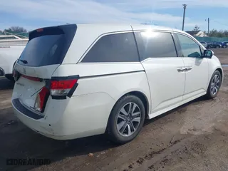 2015 Honda Odyssey Touring Elite with VIN 5FNRL5H9XFB121921, listed as a IAAI auction lot 41858551 with 61,506 mi miles. Bid and sale history available at carsss.com. Image 4.