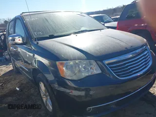 2014 Chrysler Town & Country Touring L with VIN 2C4RC1CG3ER311576, listed as a IAAI auction lot 41348818 with 142,442 mi miles and . Bid and sale history available at carsss.com. Image 1.