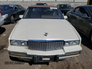 1991 Cadillac Eldorado z VIN 1G6EL13B2MU602660, wystawiony jako Copart lot #67365674 z przebiegiem 108 880 mil mil oraz Szkody całkowita. Historia ofert i sprzedaży dostępna na DreamBid. Obrazek 5.