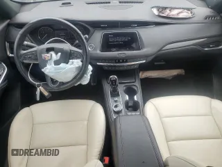 2022 Cadillac XT4 AWD Sport с VIN 1GYFZFR46NF170841, выставлен на аукционе Copart как лот 55863705 с пробегом 14 745 миль миль и Списание • Salvage title. История ставок и продаж доступна на DreamBid. Изображение 8.