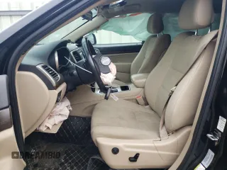 2016 Jeep Grand Cherokee Laredo with VIN 1C4RJEAG4GC394091, listed as a Copart auction lot 56595165 with 134,135 mi miles and Salvage title. Bid and sale history available at DreamBid. Image 7.