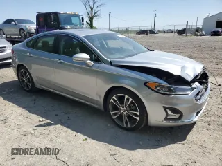 2020 Ford Fusion Titanium with VIN 3FA6P0D93LR180244, listed as a Copart auction lot 57102055 with 34,868 mi miles and Salvage title. Bid and sale history available at DreamBid. Image 4.
