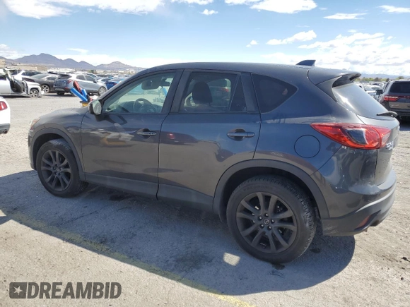 2015 Mazda CX-5 Grand Touring with VIN JM3KE4DY9F0536771, listed as a Copart auction lot 51801775 with 88,529 mi miles and Salvage Title. Bid and sale history available at DreamBid. Image 2.