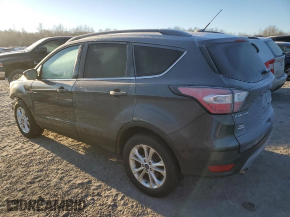 2018 Ford Escape SE z VIN 1FMCU9GD7JUA19262, wystawiony jako Copart lot #84627944 z przebiegiem 89 993 mil mil oraz Szkoda całkowita • Salvage title. Historia ofert i sprzedaży dostępna na DreamBid. Obrazek 2.