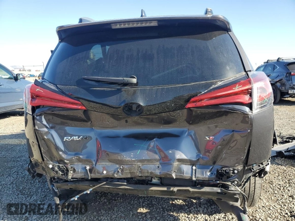 2017 Toyota RAV4 SE with VIN JTMNFREV0HJ706274, listed as a Copart auction lot 61437185 with 93,478 mi miles and Salvage title. Bid and sale history available at DreamBid. Image 6.