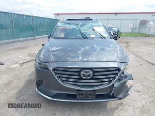 2016 Mazda CX-9 Grand Touring with VIN JM3TCBDY3G0117802, listed as a IAAI auction lot 42150821 with 157,760 mi miles and . Bid and sale history available at DreamBid. Image 12.