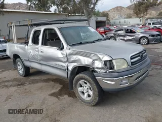 2002 Toyota Tundra SR5 with VIN 5TBRN34142S226998, listed as a IAAI auction lot 41554807 with 209,339 mi miles and . Bid and sale history available at DreamBid. Image 1.