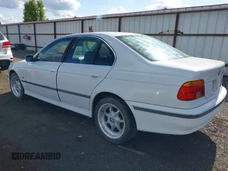 1997 BMW 5 Series 540i z VIN WBADE6327VBW53212, wystawiony jako IAAI lot #42310586 z przebiegiem Nie podano mil oraz . Historia ofert i sprzedaży dostępna na DreamBid. Obrazek 3.