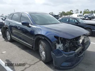 2016 Mazda CX-9 Sport with VIN JM3TCABY3G0123239, listed as a IAAI auction lot 42570700 with 119,414 mi miles and . Bid and sale history available at DreamBid. Image 1.