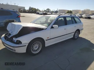 1999 BMW 5 Series 528iAt with VIN WBADP6330XBV61784, listed as a Copart auction lot 77685734 with 210,383 mi miles and Salvage Title. Bid and sale history available at carsss.com. Image 1.