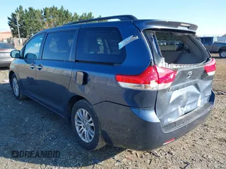 2014 Toyota Sienna XLE with VIN 5TDYK3DC2ES431320, listed as a IAAI auction lot 41977059 with 158,711 mi miles and . Bid and sale history available at DreamBid. Image 3.
