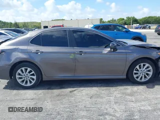 2023 Toyota Camry LE z VIN 4T1C11AK2PU080805, wystawiony jako IAAI lot #42165528 z przebiegiem 28 307 mil mil oraz . Historia ofert i sprzedaży dostępna na DreamBid. Obrazek 13.