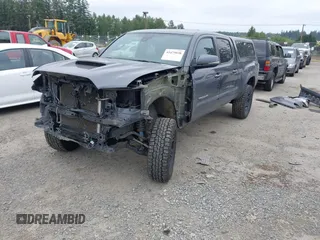 2021 Toyota Tacoma SR5 with VIN 3TMDZ5BN1MM119711, listed as a IAAI auction lot 42479038 with 64,779 mi miles and . Bid and sale history available at DreamBid. Image 2.
