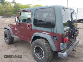 2001 Jeep Wrangler Sport with VIN 1J4FA49S31P301237, listed as a IAAI auction lot 42191884 with 154,627 mi miles and . Bid and sale history available at carsss.com. Image 3.