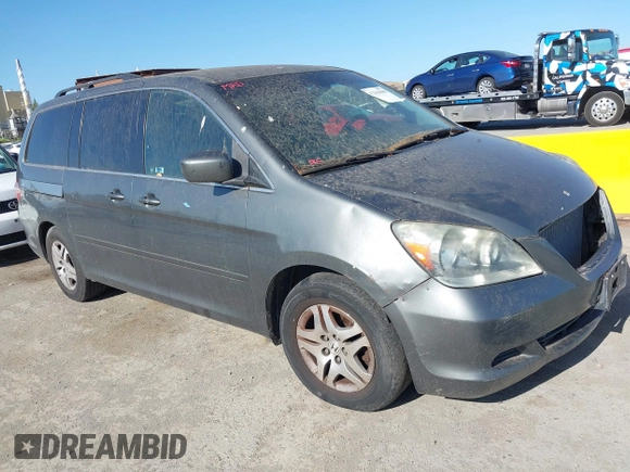 2007 Honda Odyssey EX-L z VIN 5FNRL38647B443269, wystawiony jako IAAI lot #42316300 z przebiegiem 121 616 mil mil oraz . Historia ofert i sprzedaży dostępna na DreamBid. Obrazek 1.