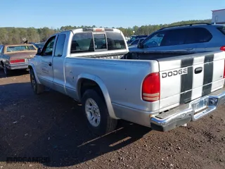 2004 Dodge Dakota SLT with VIN 1D7GL42K94S676958, listed as a IAAI auction lot 41326166 with 176,886 mi miles. Bid and sale history available at carsss.com. Image 3.