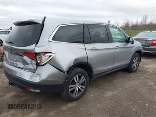 2017 Honda Pilot EX-L with VIN 5FNYF6H5XHB014067, listed as a IAAI auction lot 42083742 with 143,043 mi miles and . Bid and sale history available at DreamBid. Image 4.