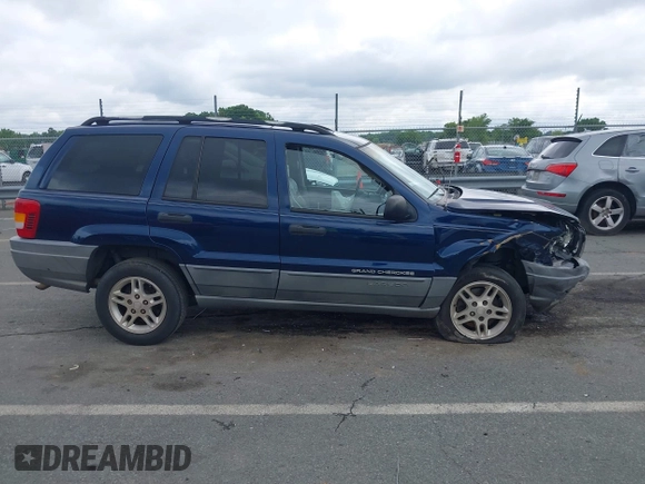 2002 Jeep Grand Cherokee Laredo with VIN 1J4GX48S02C125258, listed as a IAAI auction lot 42388724 with 295,270 mi miles and . Bid and sale history available at DreamBid. Image 13.