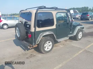 2002 Jeep Wrangler X with VIN 1J4FA39S72P733034, listed as a IAAI auction lot 42659447 with 200,786 mi miles and . Bid and sale history available at DreamBid. Image 4.