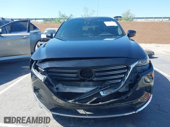 2017 Mazda CX-9 Grand Touring with VIN JM3TCBDY0H0130671, listed as a IAAI auction lot 42514237 with 81,016 mi miles and . Bid and sale history available at DreamBid. Image 12.