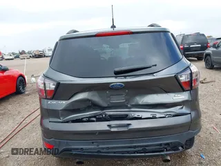2017 Ford Escape SE with VIN 1FMCU0G99HUC65571, listed as a IAAI auction lot 41923517 with 77,179 mi miles and . Bid and sale history available at DreamBid. Image 6.