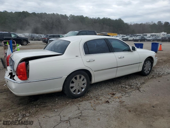 2003 Lincoln Town Car Cartier with VIN 1LNHM83W63Y604904, listed as a Copart auction lot 44057875 with 184,007 mi miles and Salvage Title. Bid and sale history available at carsss.com. Image 3.