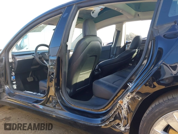 2022 Tesla Model 3 with VIN 5YJ3E1EA9NF295890, listed as a IAAI auction lot 41175917 with 42,230 mi miles and . Bid and sale history available at DreamBid. Image 6.