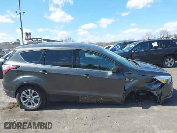 2017 Ford Escape SE with VIN 1FMCU9GD5HUC17297, listed as a IAAI auction lot 41880013 with 57,737 mi miles and . Bid and sale history available at DreamBid. Image 13.