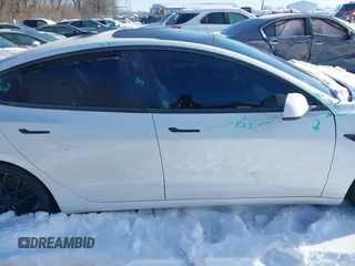 2021 Tesla Model 3 Performance with VIN 5YJ3E1EC1MF063445, listed as a IAAI auction lot 41293243 with 43,143 mi miles and . Bid and sale history available at DreamBid. Image 13.