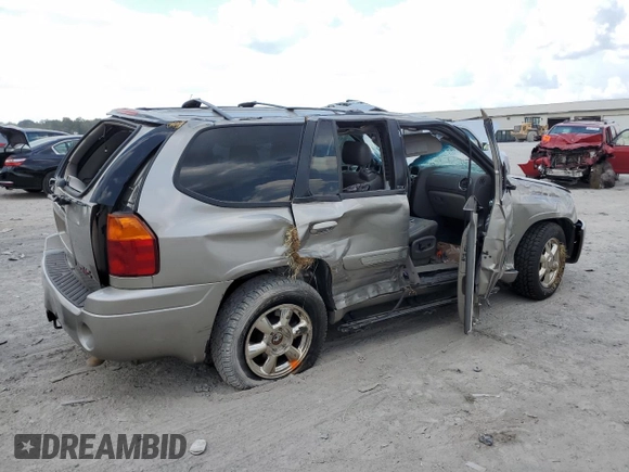 2002 GMC Envoy SLT with VIN 1GKDT13SX22380133, listed as a Copart auction lot 69816144 with 90,060 mi miles and Salvage Title. Bid and sale history available at DreamBid. Image 3.