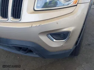 2014 Jeep Grand Cherokee Laredo with VIN 1C4RJFAG7EC380544, listed as a IAAI auction lot 42021130 with 166,589 mi miles. Bid and sale history available at carsss.com. Image 18.