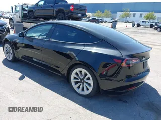 2021 Tesla Model 3 Long Range with VIN 5YJ3E1EB4MF064631, listed as a IAAI auction lot 41424856 with 95,511 mi miles and . Bid and sale history available at DreamBid. Image 3.