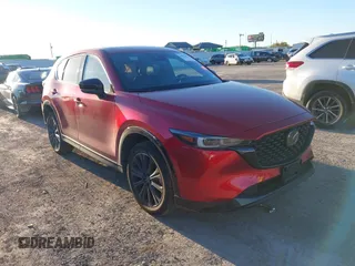 2022 Mazda CX-5 2.5 Turbo with VIN JM3KFBAY4N0564000, listed as a IAAI auction lot 41076013 with 25,106 mi miles and . Bid and sale history available at carsss.com. Image 1.