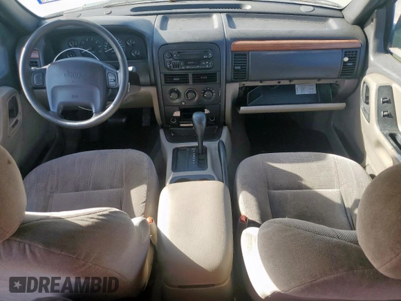 1999 Jeep Grand Cherokee Laredo with VIN 1J4G258S0XC561054, listed as a Copart auction lot 49814555 with Not provided miles and Salvage title. Bid and sale history available at DreamBid. Image 8.