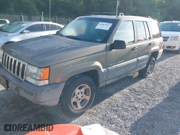 1997 Jeep Grand Cherokee Laredo with VIN 1J4GZ58S1VC603868, listed as a IAAI auction lot 42467813 with 297,306 mi miles and . Bid and sale history available at DreamBid. Image 2.