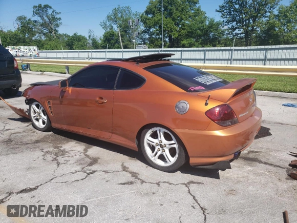 2006 Hyundai Tiburon GT z VIN KMHHN65F66U191134, wystawiony jako Copart lot #56692615 z przebiegiem 197 093 mil mil oraz Szkoda całkowita • Salvage title. Historia ofert i sprzedaży dostępna na DreamBid. Obrazek 2.