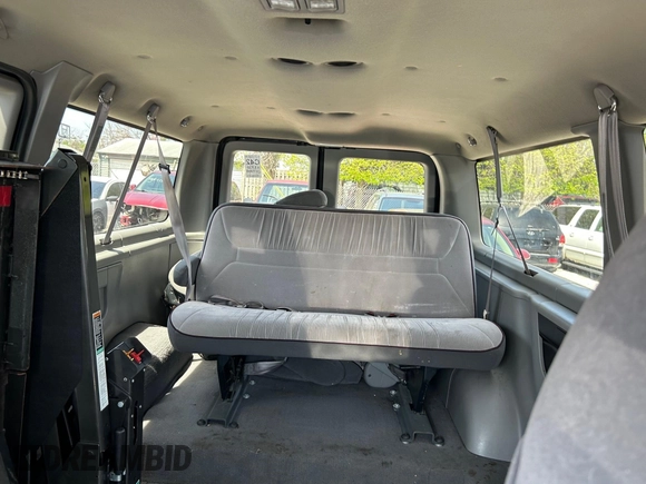 1998 Ford Econoline Passenger XL with VIN 1FMRE11L6WHB65841, listed as a IAAI auction lot 42123953 with 63,138 mi miles. Bid and sale history available at carsss.com. Image 8.