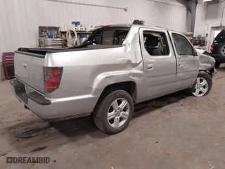 2014 Honda Ridgeline RTL with VIN 5FPYK1F57EB012362, listed as a IAAI auction lot 41078509 with 149,590 mi miles. Bid and sale history available at carsss.com. Image 4.