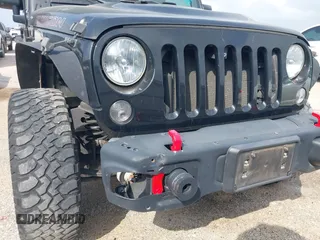 2015 Jeep Wrangler Unlimited Rubicon z VIN 1C4BJWFG2FL572417, wystawiony jako IAAI lot #41895927 z przebiegiem 54 981 mil mil oraz . Historia ofert i sprzedaży dostępna na DreamBid. Obrazek 6.