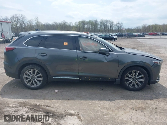 2016 Mazda CX-9 Grand Touring with VIN JM3TCBDY3G0117802, listed as a IAAI auction lot 42150821 with 157,760 mi miles and . Bid and sale history available at DreamBid. Image 13.