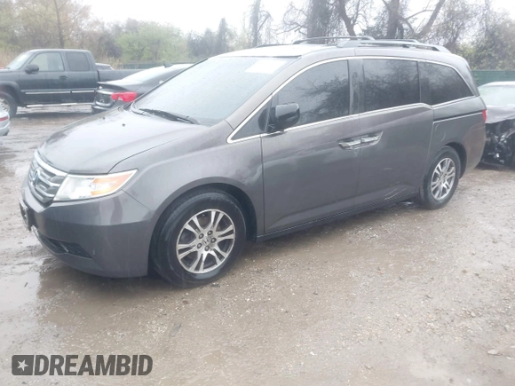 2012 Honda Odyssey EX-L with VIN 5FNRL5H6XCB057557, listed as a IAAI auction lot 42022410 with 174,286 mi miles and . Bid and sale history available at DreamBid. Image 2.