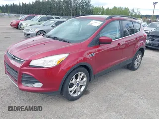 2013 Ford Escape SE with VIN 1FMCU9GXXDUB73916, listed as a IAAI auction lot 42086263 with 176,226 mi miles and . Bid and sale history available at DreamBid. Image 2.