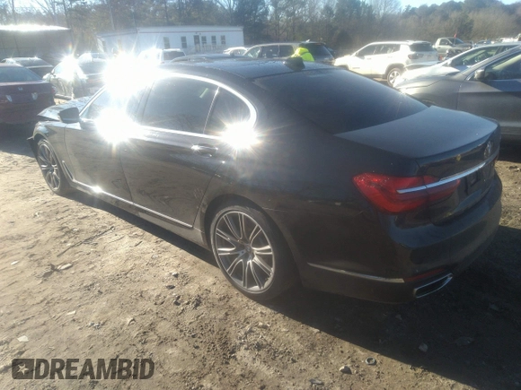 2018 BMW 7 Series 740i with VIN WBA7E2C57JG742257, listed as a IAAI auction lot 41353435 with 77,125 mi miles. Bid and sale history available at carsss.com. Image 3.